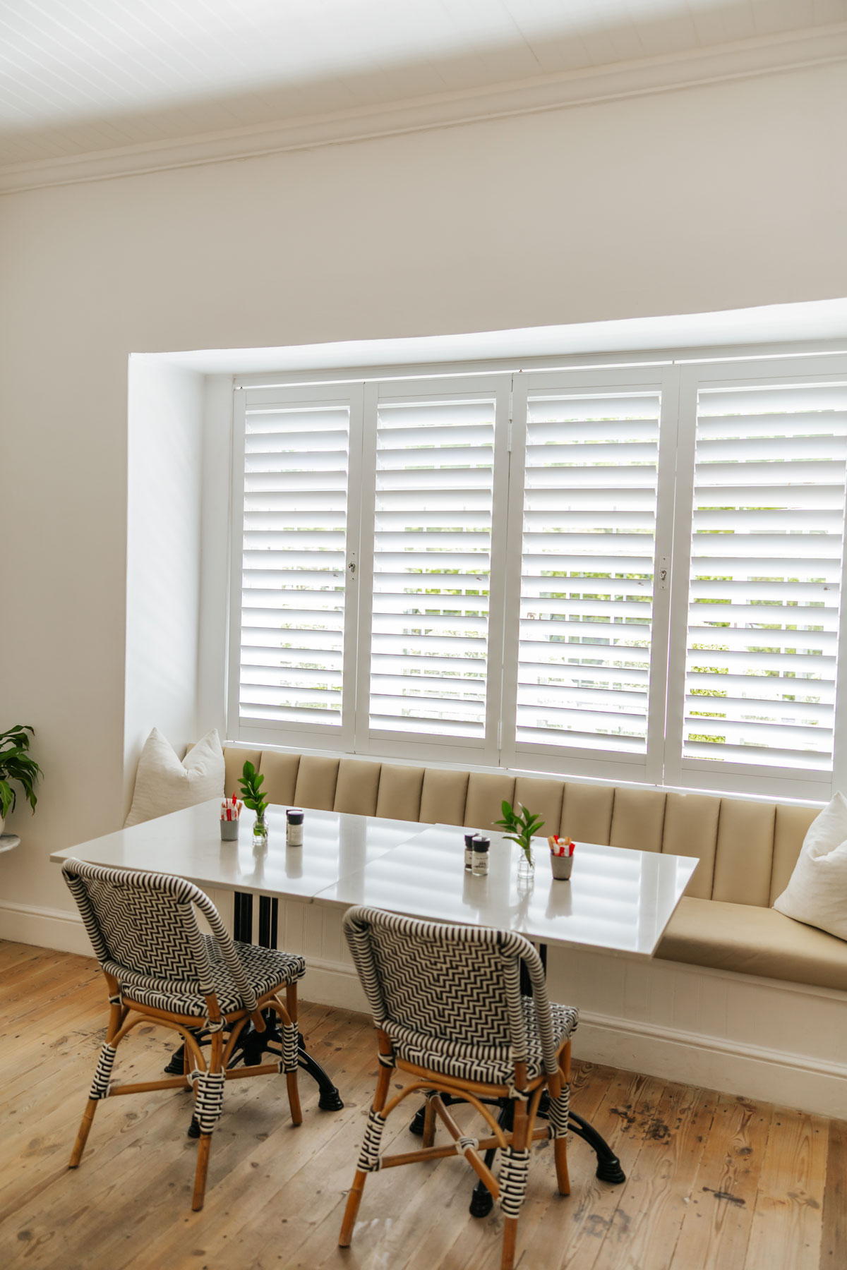 White shutters in a breakfast nook